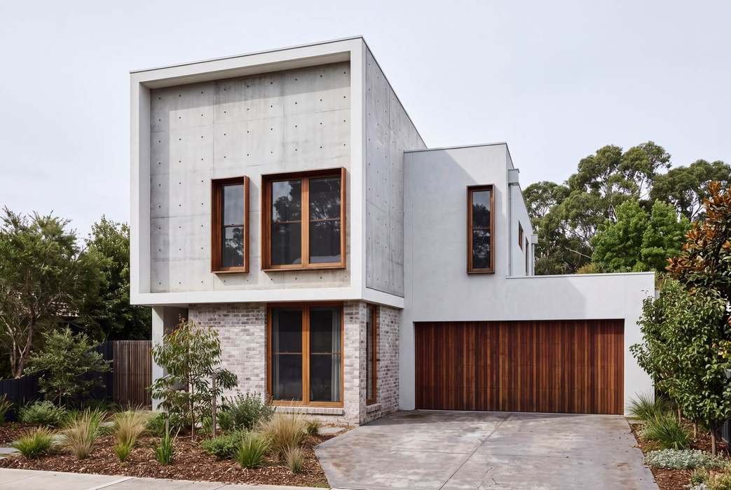 Two-storey house facade, concrete and brick